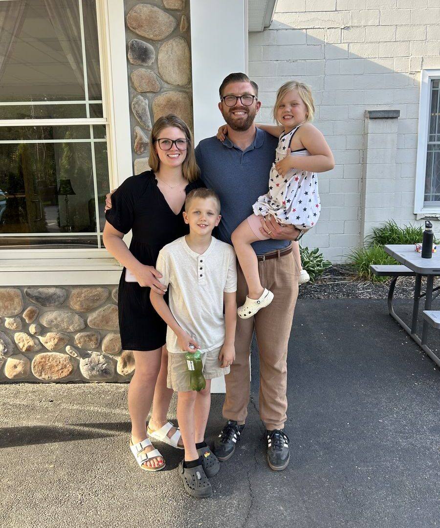 Christian Bartulovich with his wife and children